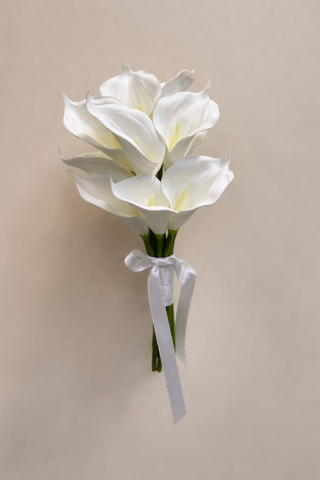 White calla lily artificial bridesmaid bouquet tied with a white satin ribbon
